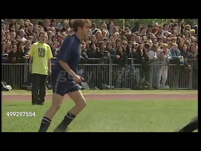 Liam Gallagher playing football with robbie Williams and Damon Albarn